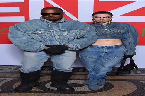 Kanye West and new girlfriend Julia Fox wear matching double denim as they attend first fashion..