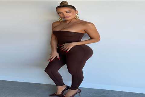 Khloe Kardashian smiles & shows off slim figure in skintight SKIMS catsuit as ex Tristan..