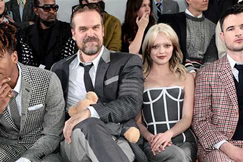 David Harbor cuddles a teddy bear at the Thom Browne fashion show with Maisie Williams & Danai..