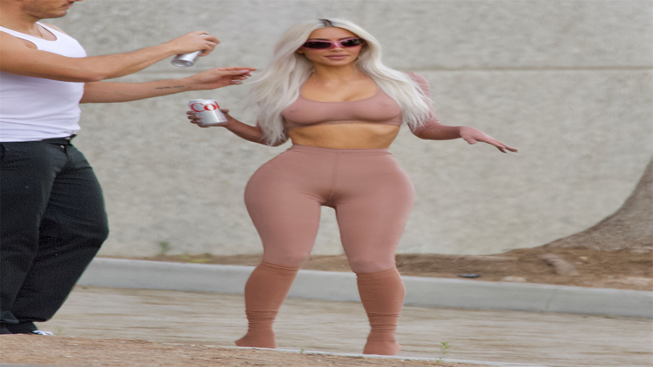 Kim Kardashian stuns in a nude croptop and leggings as boyfriend Pete Davidson supports her sexy SKIMS photoshoot