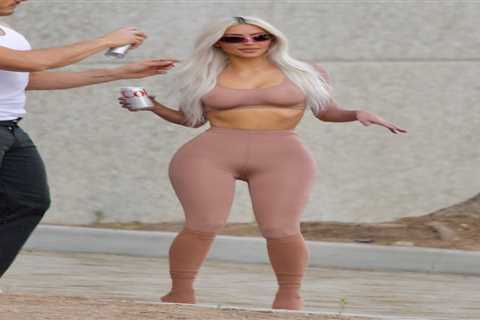 Kim Kardashian stuns in a nude croptop and leggings as boyfriend Pete Davidson supports her sexy..