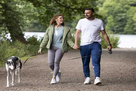 Chanelle Hayes flashes her sparkling engagement ring as she kisses fiancé Dan Bingham on dog walk