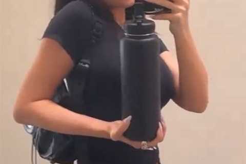Kylie Jenner shows off her tiny waist in just a crop top just months after giving birth to baby son