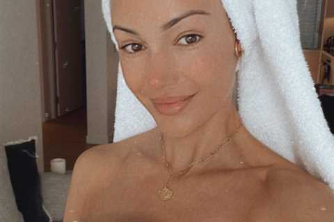 Michelle Keegan reveals flawless skin as she poses in just a towel in hotel room
