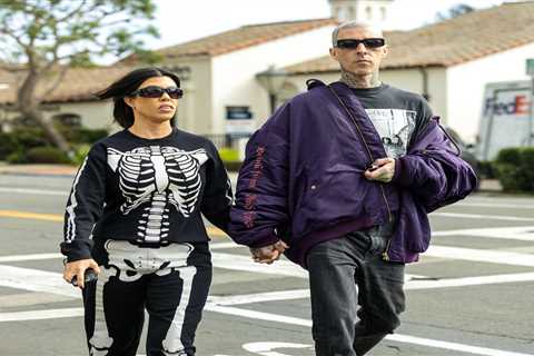 Kourtney Kardashian covers her stomach in baggy skeleton onesie after fans think she ‘subtly..