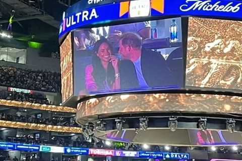Meghan Markle & Prince Harry tease fans as they giggle and pull faces on ‘kiss cam’ at Lakers game..