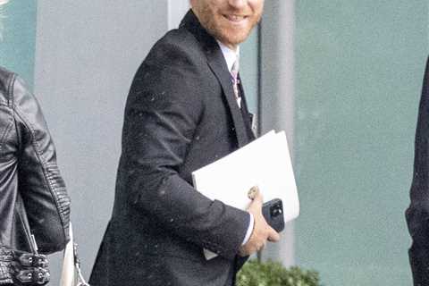 Prince Harry grins at Heathrow before jetting to LA just an hour after coronation as his family..
