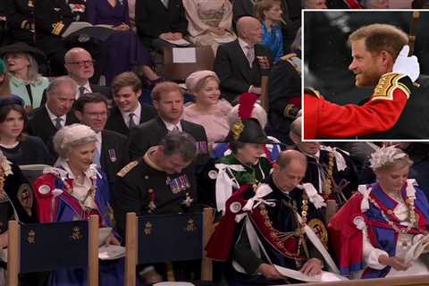 Harry smiles as he arrives separately from William for coronation and sits in third row in huge snub