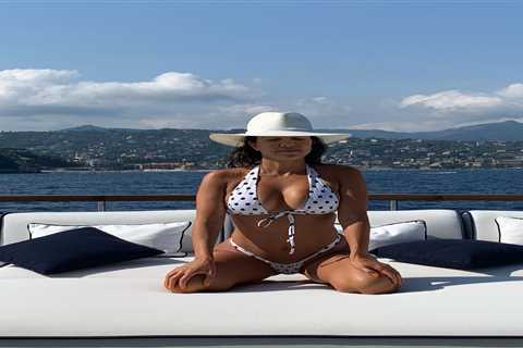 Kourtney Kardashian almost bursts out of teeny bikini while posing on boat in sexy photos from..