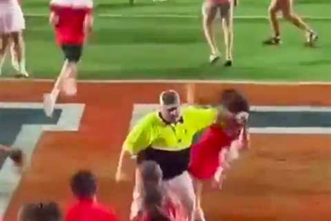 Female Ole Miss fan bulldozed by security while trying to storm field