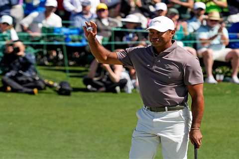 Tiger Woods sets another Masters record with 24th consecutive made cut after grueling second day