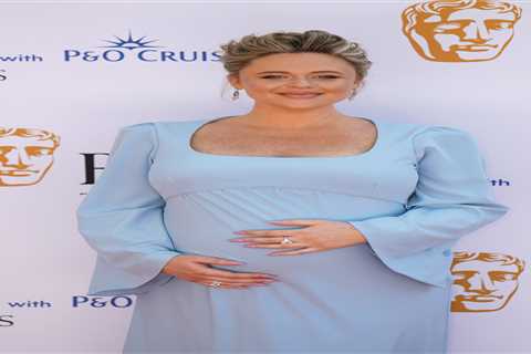 Emily Atack stuns in baby blue gown at Baftas, cradling her baby bump