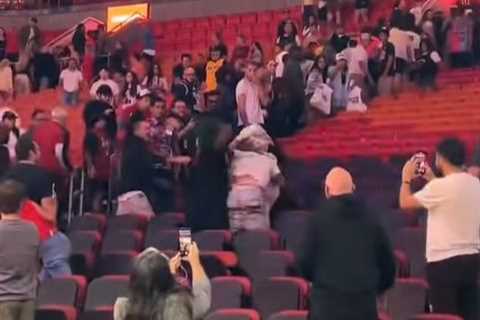 Heat fans get in vicious brawl — distracting Tyler Herro during TV interview