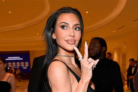 Kim Kardashian Crawls Through Christmas Chaos in Video For Travis Barker-Produced ‘Santa Baby’ Cover