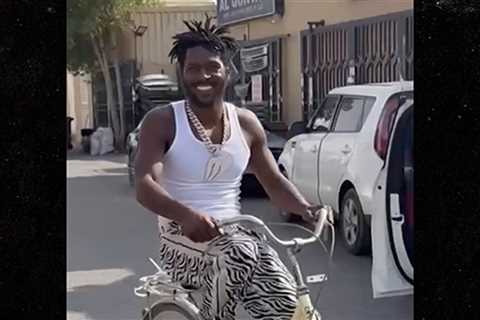 Antonio Brown All Smiles On Bike Ride Despite Arrest Warrant