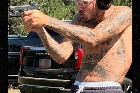 Justin Bieber Shooting Guns Shirtless
