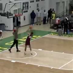 Fan runs onto court to stop shot attempt in wild college basketball scene