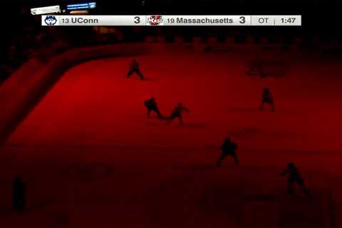 College hockey game stopped during OT scoring chance after lights turn off in bizarre scene