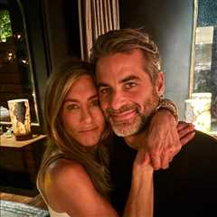 Jennifer Aniston & Boyfriend Jim Curtis Wrap Their Arms Around Each Other in Rare Pic