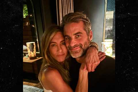 Jennifer Aniston & Boyfriend Jim Curtis Wrap Their Arms Around Each Other in Rare Pic