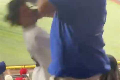 Taunting Yankees fan brutally beaten up by Rangers fans, girlfriend thrown down steps in wild scene