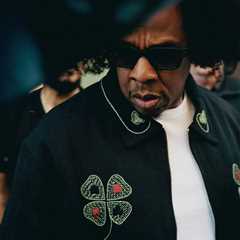Jay-Z Wore His New Afro and a $1,183 Bode Lucky Draw Embroidered Jacket to the NBA Finals in New..