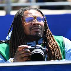 Marshawn Lynch works as photographer for USA vs Australia match