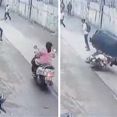 Runaway Bull Violently Knocks Woman Off Scooter In India, On Video