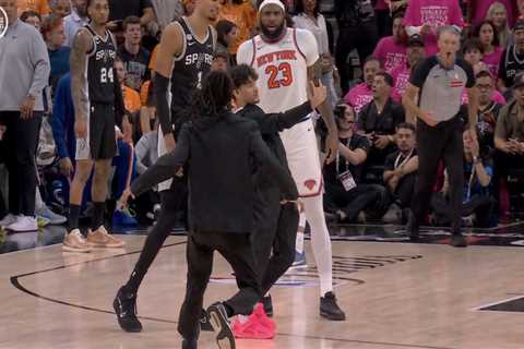 Selfie-taking fan storms court in surreal NBA Finals Game 1 scene