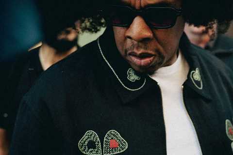 Jay-Z Wore His New Afro and a $1,183 Bode Lucky Draw Embroidered Jacket to the NBA Finals in New..
