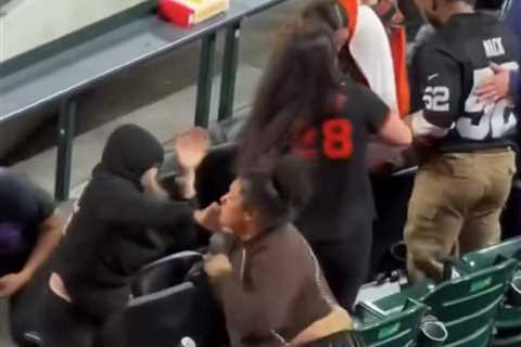 Female fan brawl breaks out at Giants-Rockies game as man violently pummels woman