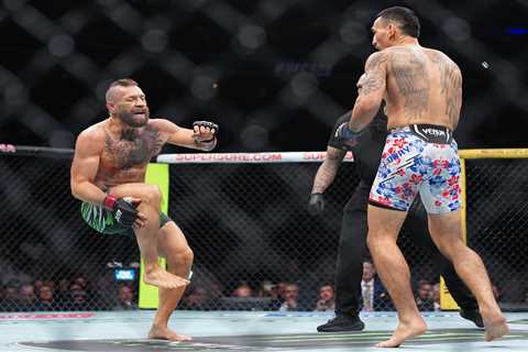 Conor McGregor injures leg just seconds into fight in quick loss to Max Holloway — and is heavily..
